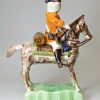 Staffordshire pottery figure of a Hussar on horseback decorated with enamels under the glaze, circa 1760