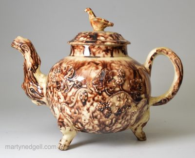 Creamware pottery teapot decorated with Whieldon type colours under the glaze, circa 1770