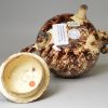 Creamware pottery teapot decorated with Whieldon type colours under the glaze, circa 1770