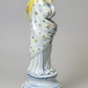 Perarlware pottery figure of Summer decorated with colours under the glaze, circa 1820