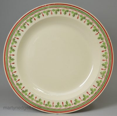 Creamware pottery plate with a painted border, circa 1800