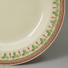 Creamware pottery plate with a painted border, circa 1800