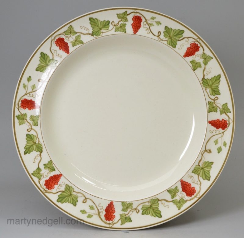Wedgwood creamware pottery plate with painted grapevine border made for James Powell & Sons, circa 1900