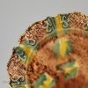Creamware plate decorated with Whieldon type colours under the glaze, circa 1770