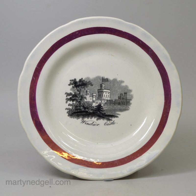 Small pearlware pottery plate decorated with a print of Windsor Castle and a pink lustre border, circa 1840
