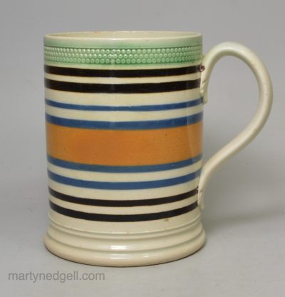 Mochaware pearlware mug decorated with bands of slip, circa 1820