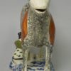 Pearlware pottery cow creamer decorated with colours and sponging under the glaze, circa 1820