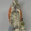 Pearlware pottery cow creamer decorated with colours and sponging under the glaze, circa 1820