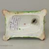 Staffordshire pearlware pottery dog decorated with overglaze enamels, circa 1820