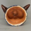 Buff pottery fox head stirrup cup, circa 1820