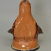 Buff pottery fox head stirrup cup, circa 1820