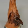 Buff pottery fox head stirrup cup, circa 1820