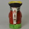 Miniature pearlware pottery Toby jug decorated with enamels over the glaze, circa 1820