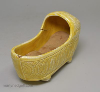 Canary yellow toy cradle, circa 1820