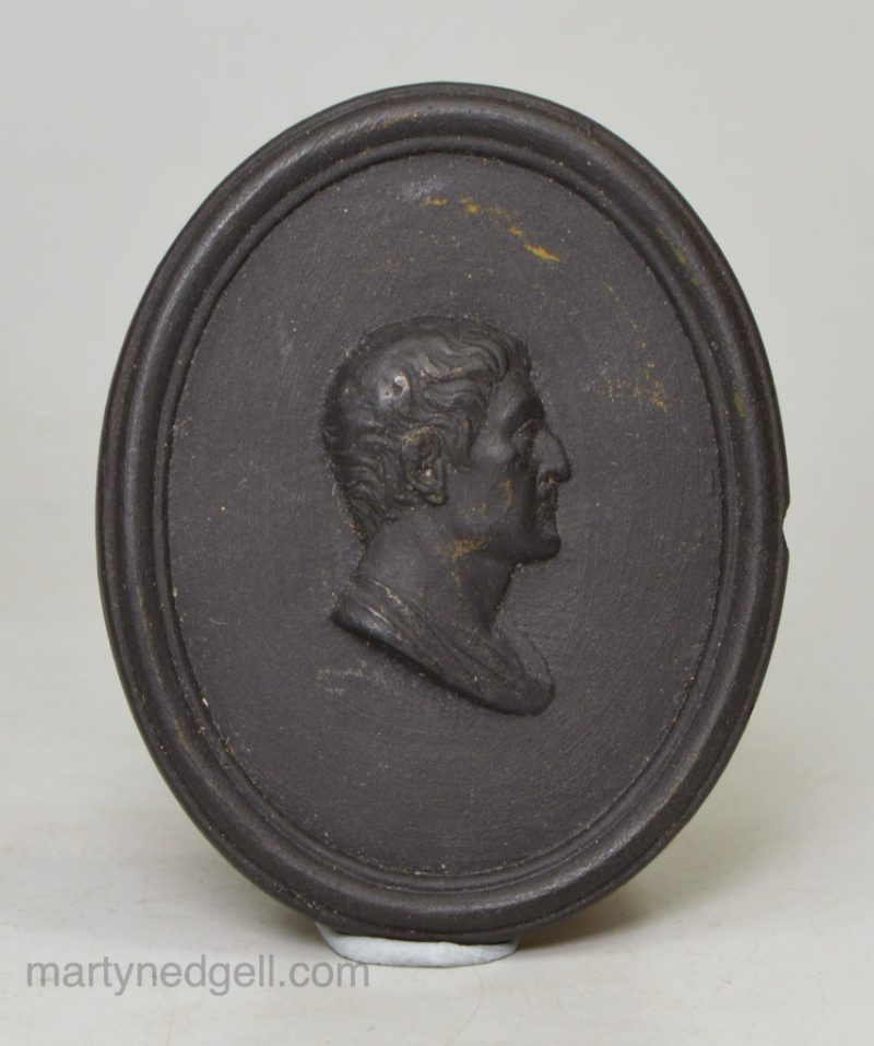 Small black basalt plaque of a Roman, circa 1790
