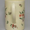 Creamware pottery tankard, decorated with floral enamels over the glaze, circa 1780