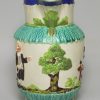 Pearlware pottery jug moulded with the Vicar, Sexton and Clerk decorated with colours over the glaze, circa 1810