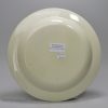 Creamware pottery plate decorated with a canary and sponged trees under the glaze, circa 1820