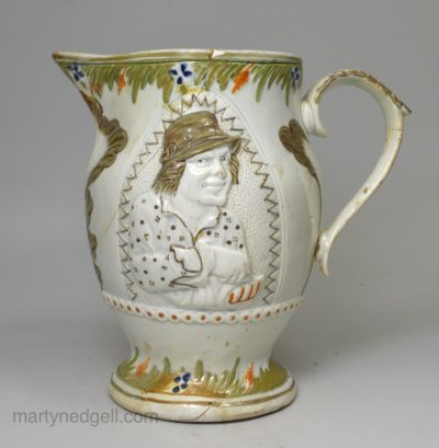 Prattware pottery jug moulded with the Miser and the Spendthrift, circa 1820