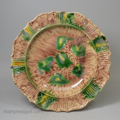 Creamware pottery soup plate decorated with Whieldon type colours under the glaze, circa 1770