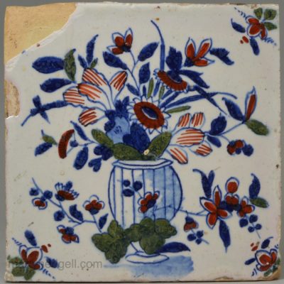 London delft tile painted in blue, red and green, circa 1730