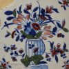 London delft tile painted in blue, red and green, circa 1730