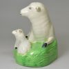 Creamware pottery model of a ewe and lamb decorated under the glaze, circa 1800