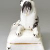 Staffordshire porcelain spaniel on a cushion, circa 1840