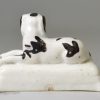 Staffordshire porcelain spaniel on a cushion, circa 1840
