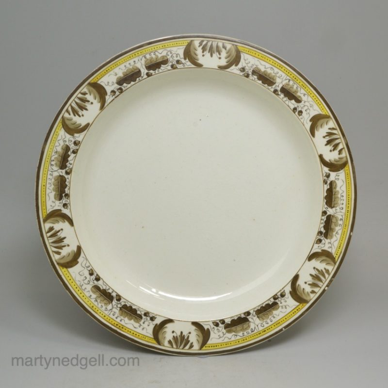 Creamware pottery plate decorated with over glaze enamels, circa 1800