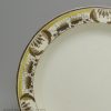 Creamware pottery plate decorated with over glaze enamels, circa 1800