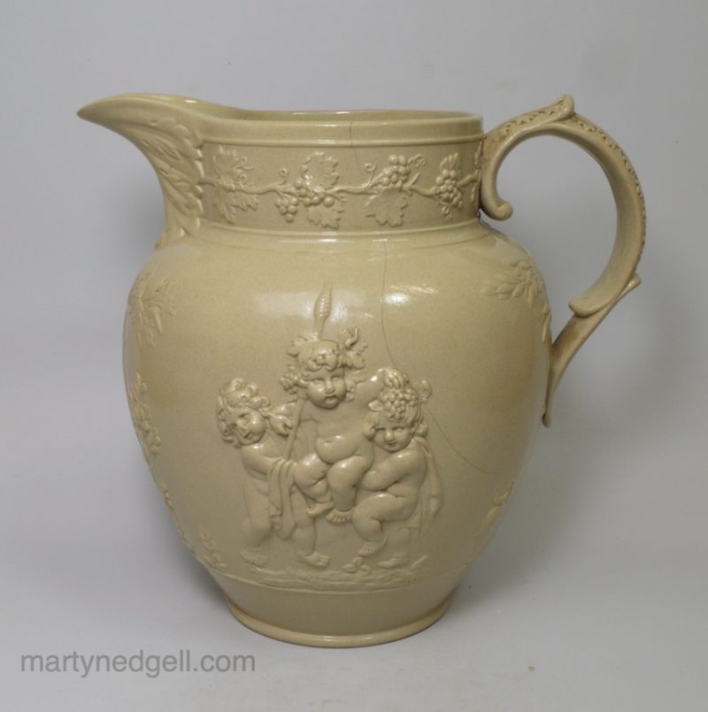 Large "SPODE" drabware jug moulded with bacchanalian boys, circa 1820