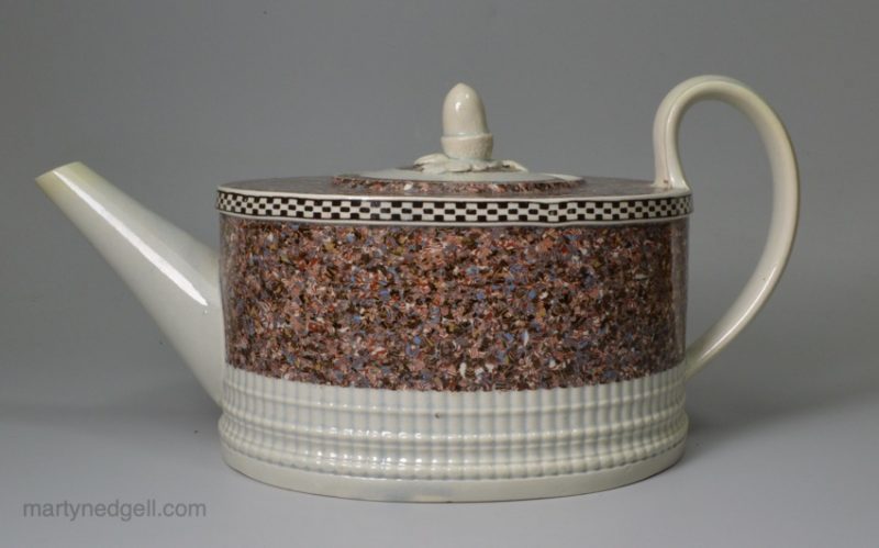 Pearlware pottery teapot decorated with a layer of agate ware, circa 1800