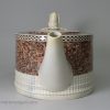 Pearlware pottery teapot decorated with a layer of agate ware, circa 1800