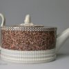 Pearlware pottery teapot decorated with a layer of agate ware, circa 1800