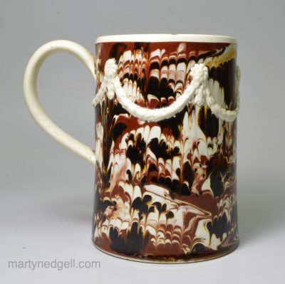 Mochaware pearlware pottery mug decorated with combed slip, circa 1790
