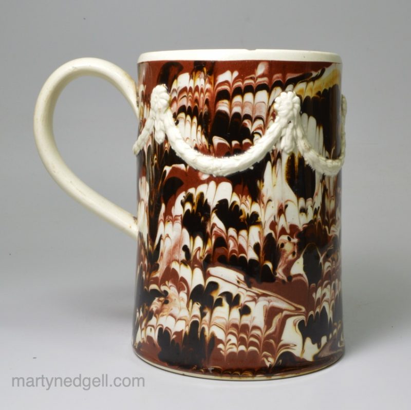 Mochaware pearlware pottery mug decorated with combed slip, circa 1790