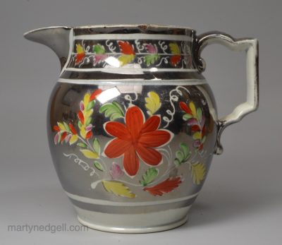 Small pearlware pottery jug decorated with silver lustre resist and enamels, circa 1820
