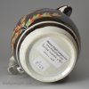 Small pearlware pottery jug decorated with silver lustre resist and enamels, circa 1820