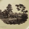 Wedgwood creamware plate printed with a watermill scene below an armorial, circa 1775