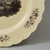 Wedgwood creamware plate printed with a watermill scene below an armorial, circa 1775