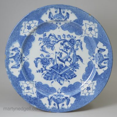 Bristol delft plate decorated in blue with a Qilin and powder blue ground, circa 1740