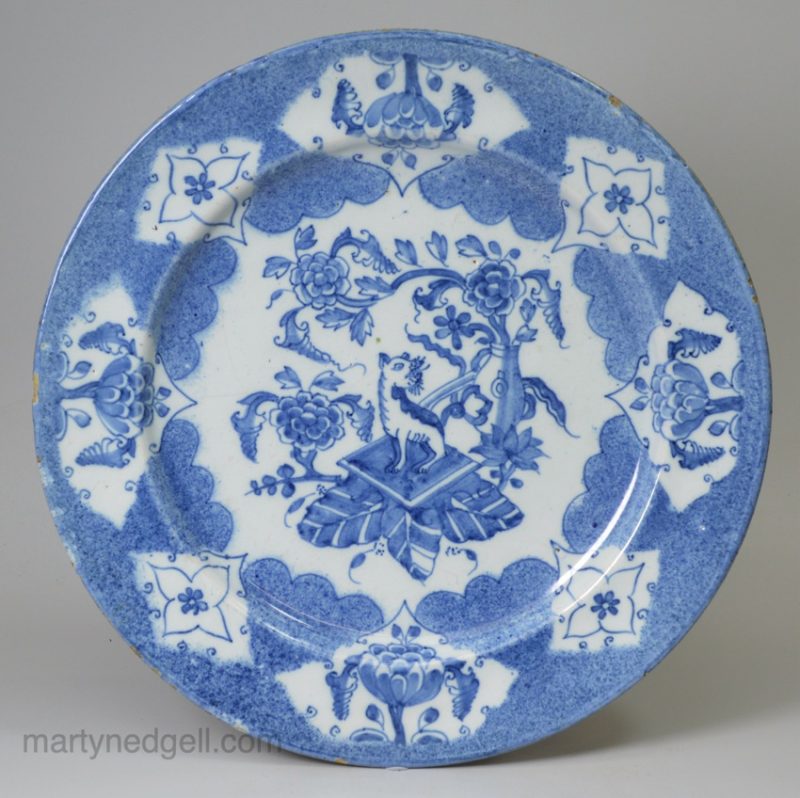 Bristol delft plate decorated in blue with a Qilin and powder blue ground, circa 1740