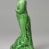 Creamware gren glazed pottery figure of a bacchanalian boy, circa 1790