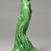 Creamware gren glazed pottery figure of a bacchanalian boy, circa 1790