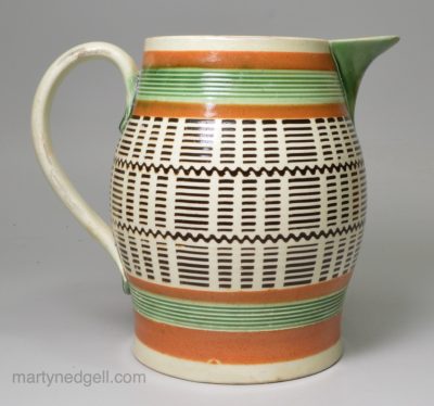 Mochaware jug decorated with inlayed slip on a pearlware pottery body, circa 1820
