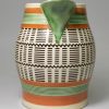 Mochaware jug decorated with inlayed slip on a pearlware pottery body, circa 1820