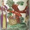 Creamware pottery mug decorated with a coloured print, dated 1770