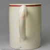 Creamware pottery mug decorated with a coloured print, dated 1770