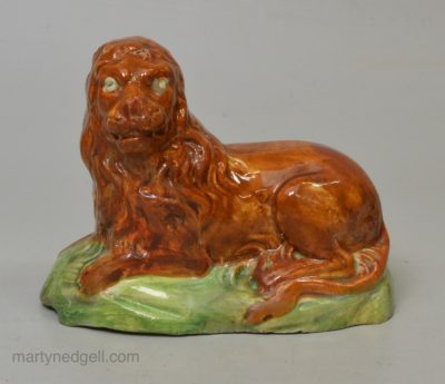 Creamware pottery lion decorated with underglaze colours, circa 1800